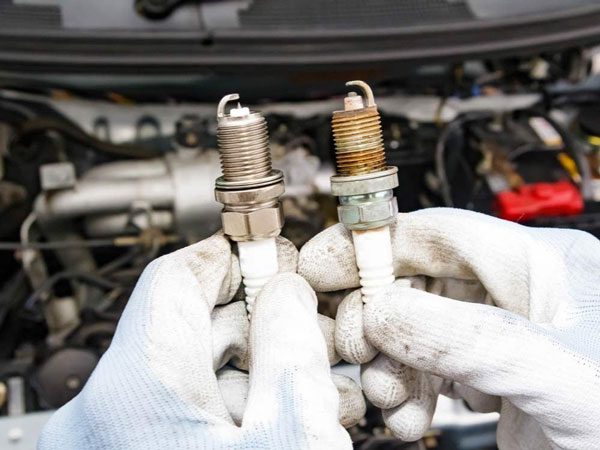 Why is my car sputtering after I changed the spark plugs