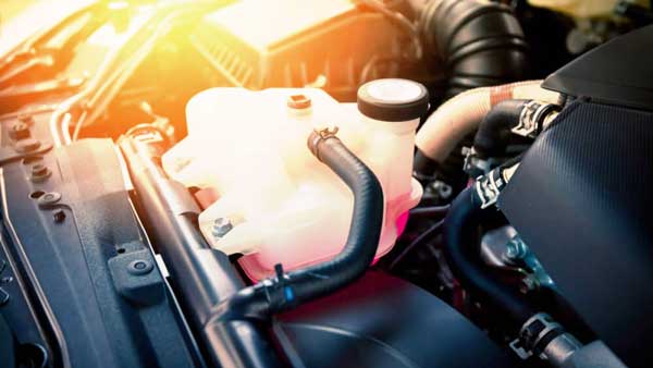 What should you do if your car is overheating and leaking coolant